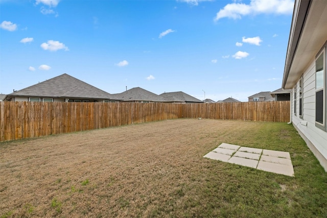 view of yard with a fenced backyard