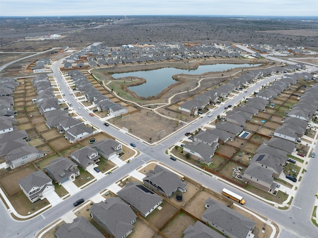 bird's eye view featuring a water view and a residential view