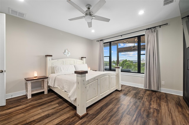 bedroom with ceiling fan and dark hardwood / wood-style flooring