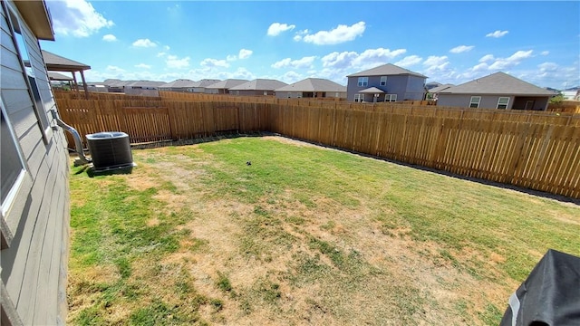 view of yard featuring central AC