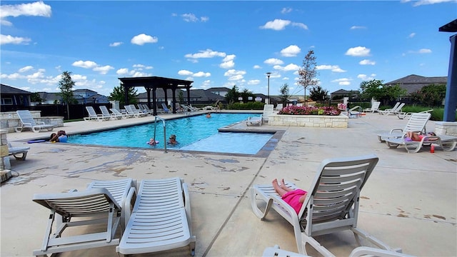 view of swimming pool featuring a patio area