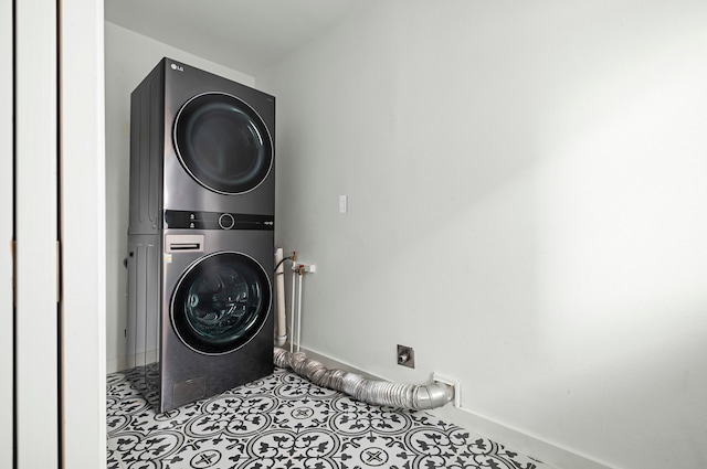 laundry area with stacked washing maching and dryer