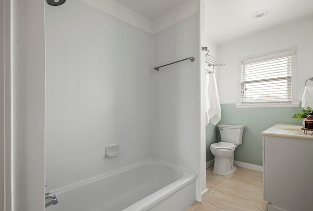 full bathroom with vanity, tiled shower / bath, and toilet