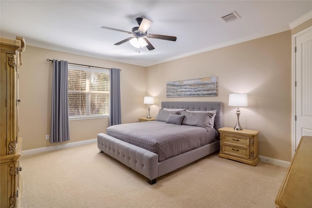 carpeted bedroom featuring ceiling fan and crown molding