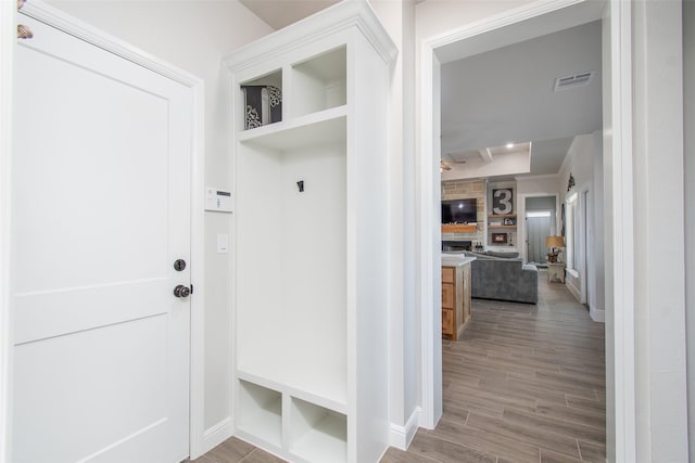 mudroom with hardwood / wood-style flooring