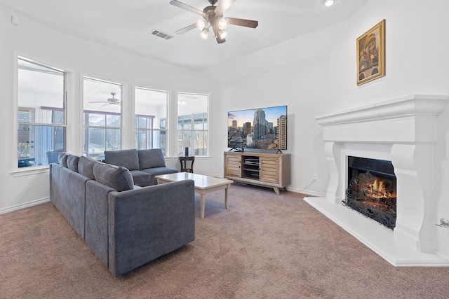 carpeted living room featuring ceiling fan