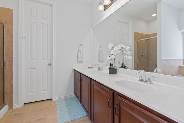 bathroom featuring tile patterned floors, vanity, and an enclosed shower