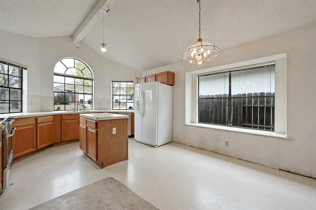 kitchen with hanging light fixtures, white fridge with ice dispenser, a textured ceiling, and a center island