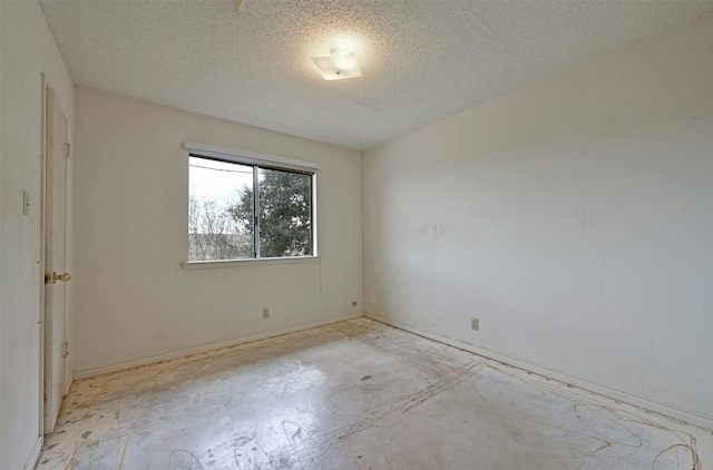 spare room featuring a textured ceiling