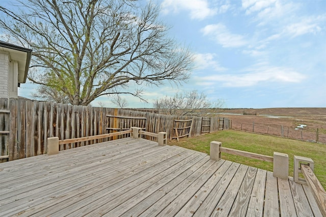 wooden deck with a lawn