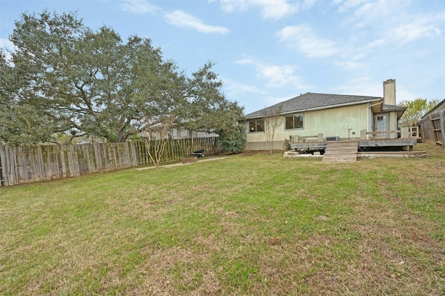 view of yard featuring a wooden deck