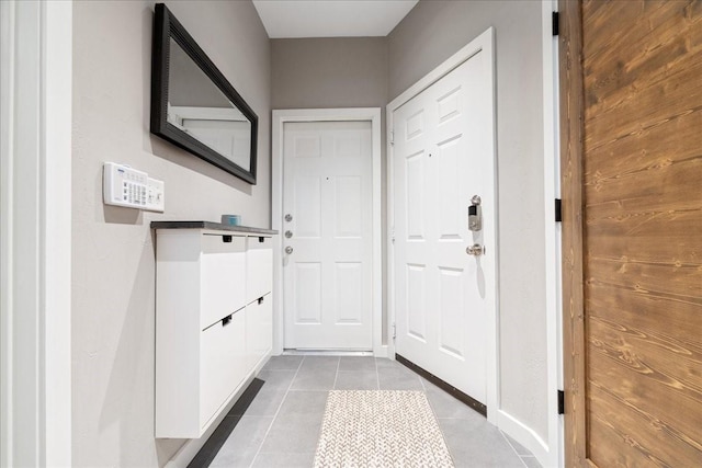 entryway with light tile patterned floors