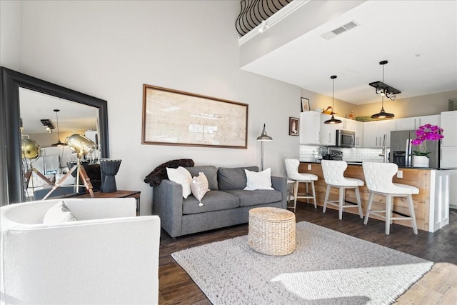 living room with dark wood-type flooring