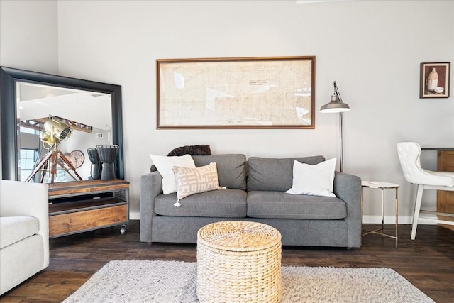 living room with dark hardwood / wood-style flooring