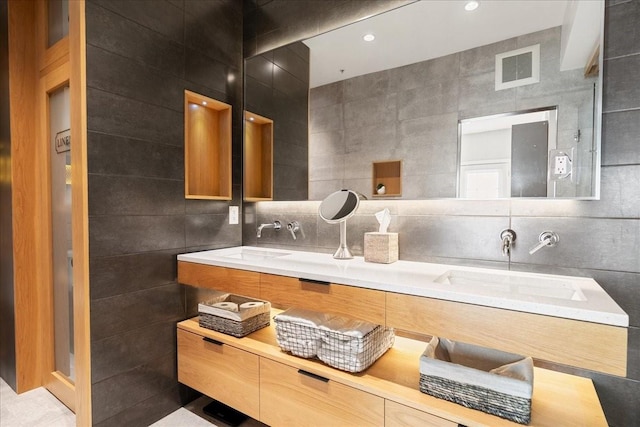 bathroom with tile walls, backsplash, and vanity