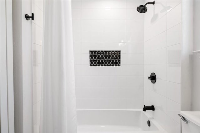 bathroom with toilet and shower / bath combination with curtain