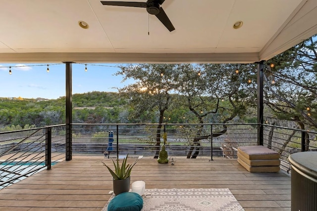 wooden terrace with ceiling fan