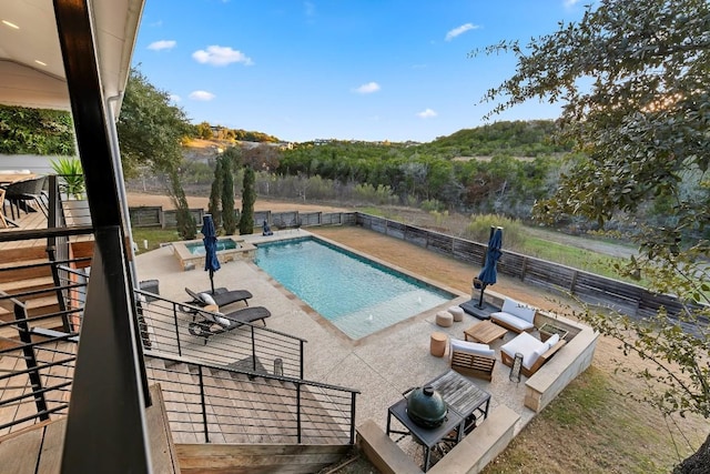 view of pool featuring an in ground hot tub and a patio