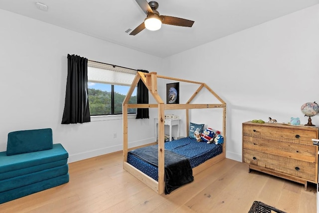 bedroom featuring ceiling fan and wood-type flooring