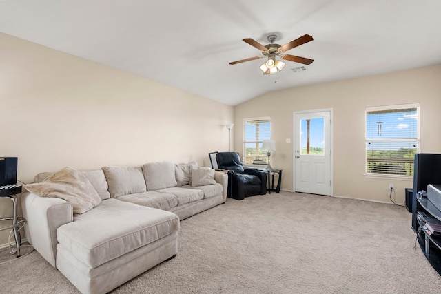 carpeted living room featuring ceiling fan and vaulted ceiling