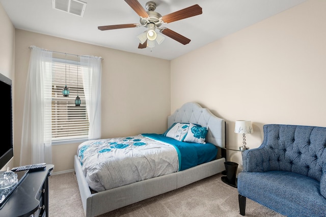 bedroom featuring ceiling fan and light colored carpet