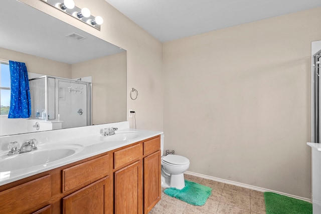 bathroom with toilet, a shower with shower door, and vanity