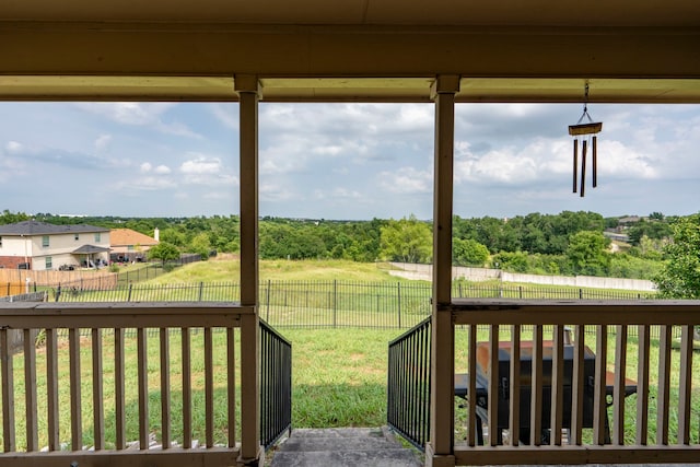 wooden deck with a yard