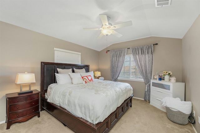 bedroom featuring vaulted ceiling, ceiling fan, and light carpet