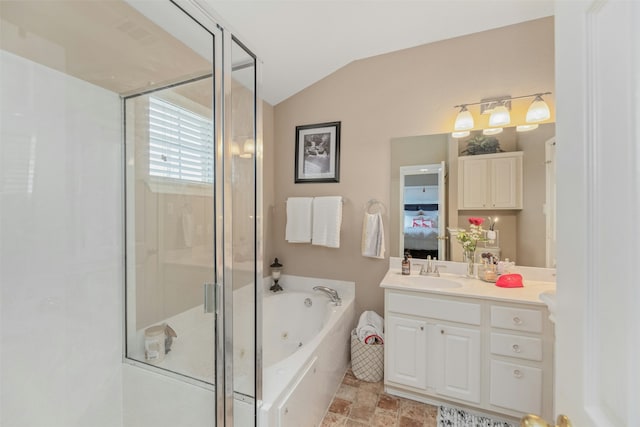 bathroom featuring lofted ceiling, vanity, and separate shower and tub