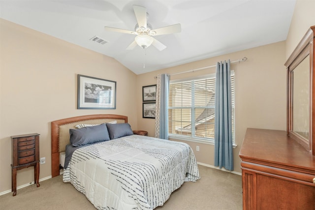 bedroom with ceiling fan, light carpet, and vaulted ceiling