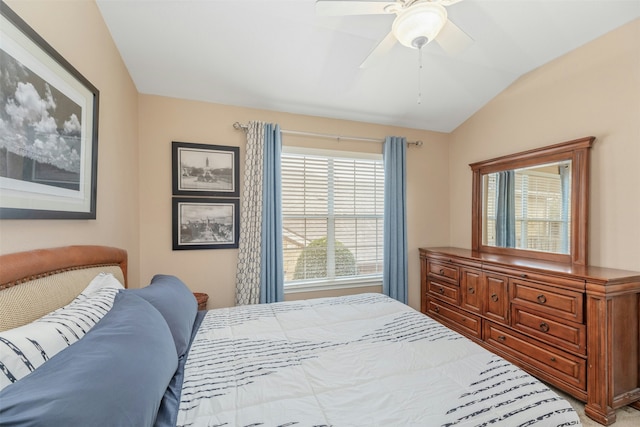 bedroom featuring ceiling fan and lofted ceiling