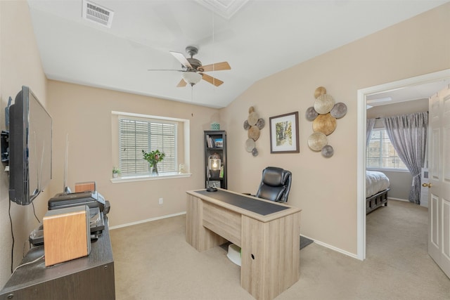 office space with ceiling fan, lofted ceiling, and light carpet