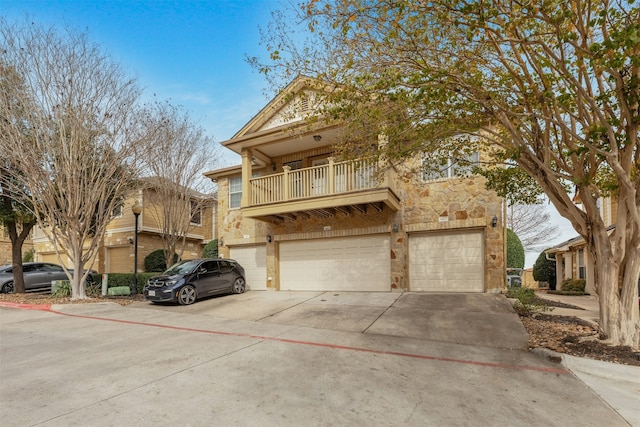 view of front of house with a balcony and a garage