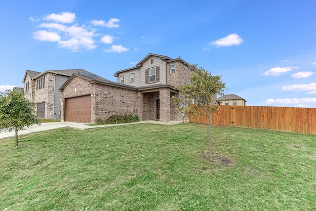 view of front of house with a garage and a front yard