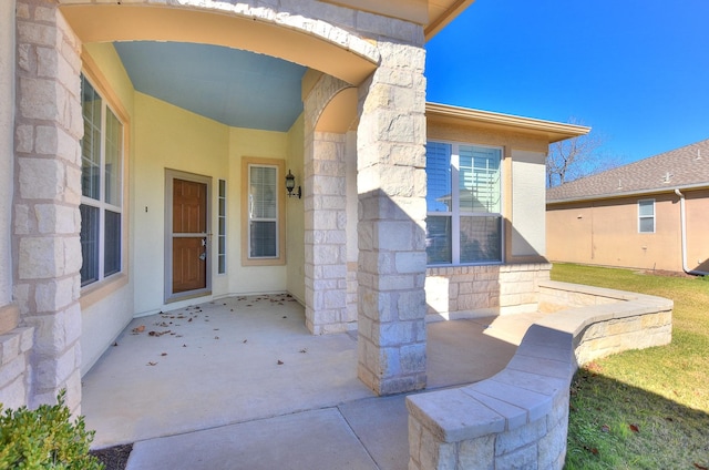 property entrance with a patio area