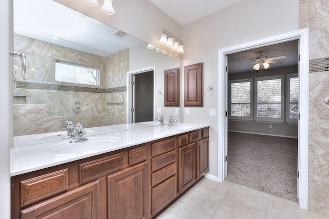 bathroom featuring ceiling fan, vanity, and tile patterned flooring