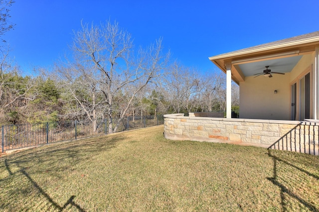 view of yard with ceiling fan