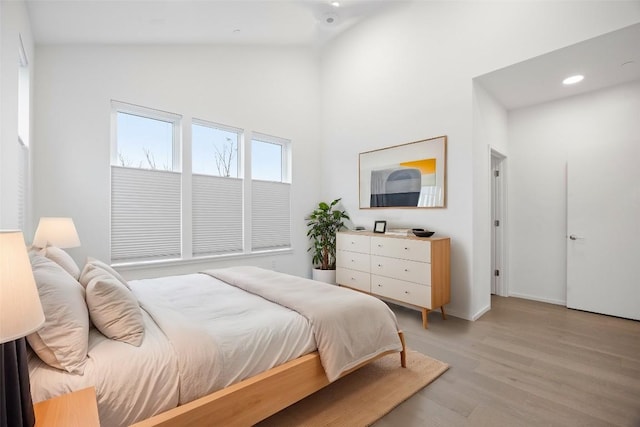3100 Menchaca Rd Unit 29, Austin, TX 78704 - bedroom featuring high vaulted ceiling, light wood-style floors, and recessed lighting