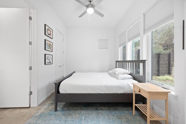 3100 Menchaca Rd Unit 29, Austin, TX 78704 - bedroom featuring a ceiling fan and concrete floors