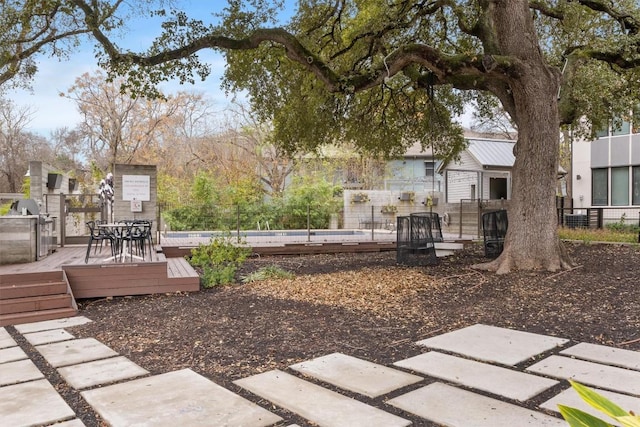 3100 Menchaca Rd Unit 29, Austin, TX 78704 - view of yard featuring a deck and outdoor dining space