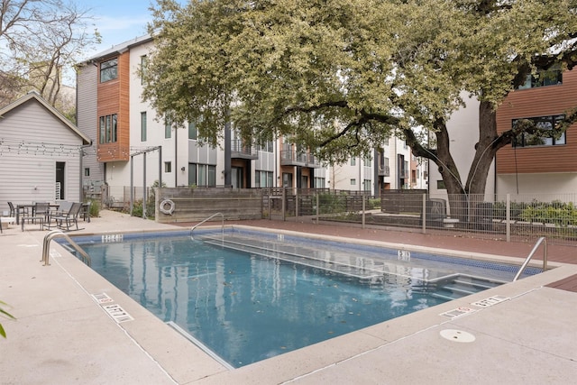 view of swimming pool featuring a patio