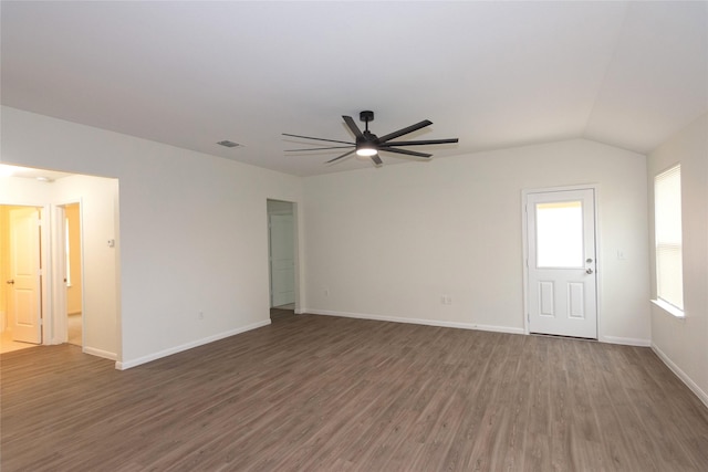 unfurnished living room with ceiling fan, dark hardwood / wood-style flooring, and vaulted ceiling