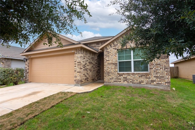 view of front of home featuring a front lawn and a garage