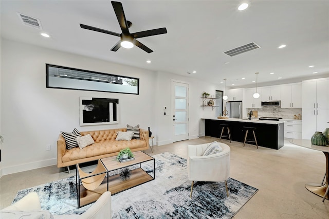 living room with ceiling fan