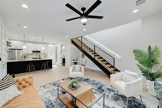 living room featuring ceiling fan