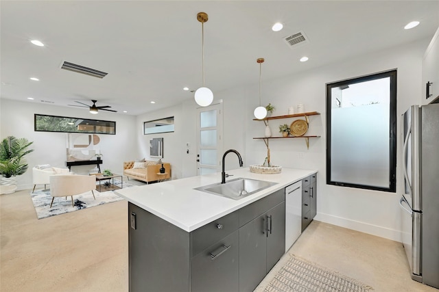 kitchen with sink, gray cabinetry, decorative light fixtures, stainless steel fridge, and dishwasher