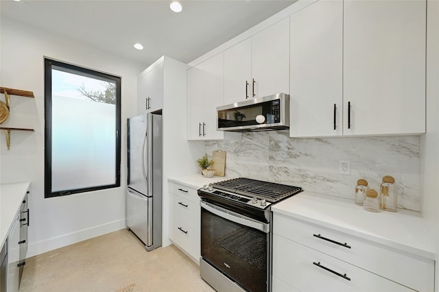 kitchen with white cabinetry, appliances with stainless steel finishes, and decorative backsplash