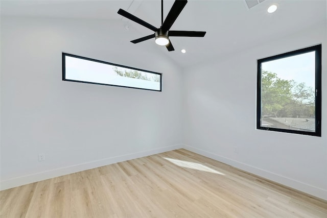 unfurnished room with vaulted ceiling, ceiling fan, and light wood-type flooring