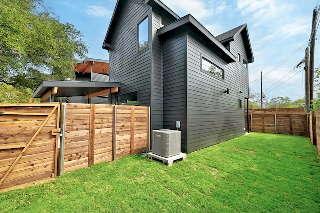 view of property exterior featuring central AC unit and a lawn