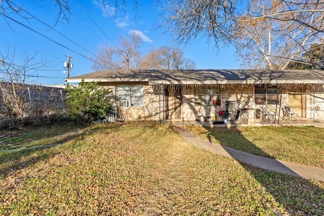 back of house with a lawn